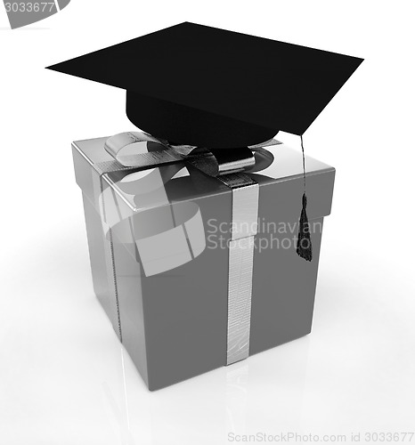 Image of graduation hat on a red gift