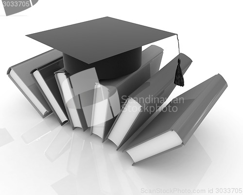 Image of Colorful books and graduation hat 