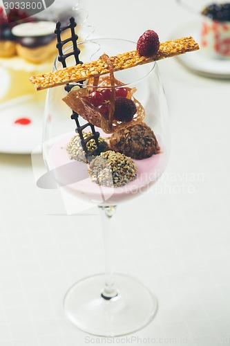 Image of Close up of chocolate truffles in elegant glasses