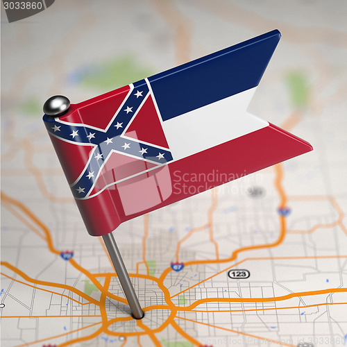Image of Mississippi Small Flag on a Map Background.