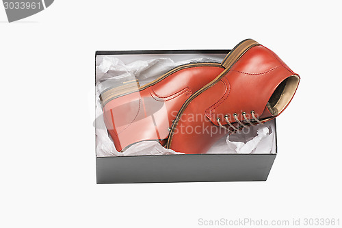 Image of new red shoes in box