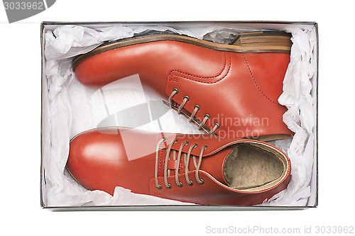 Image of new red shoes in box