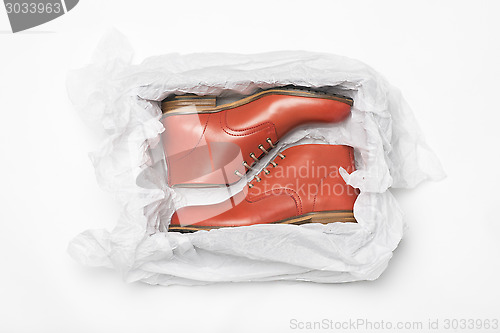 Image of new red shoes in box