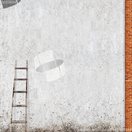 Image of weathered brick wall with a wooden ladder