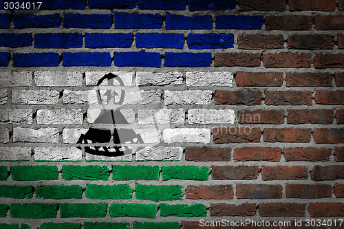 Image of Brick wall texture with flag