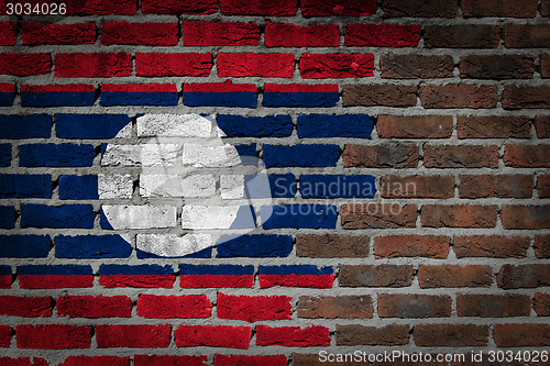 Image of Brick wall texture with flag