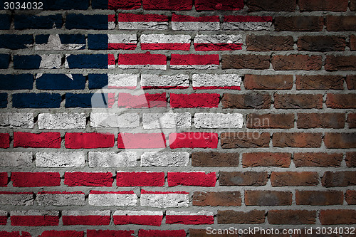 Image of Brick wall texture with flag