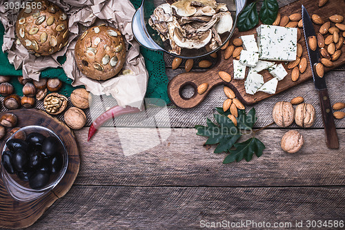 Image of Lunch olives, nuts and  sheep cheese with bread