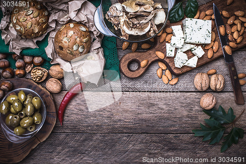 Image of Olives, nuts and  sheep cheese with bread