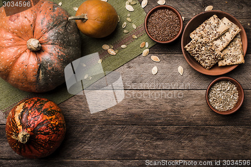 Image of Cookies with pumkins and seeds on wood