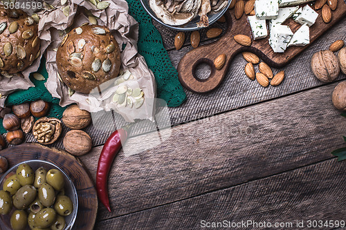 Image of sheep cheese with bread, Olives and nuts