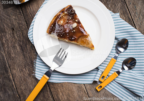 Image of pie on plate wooden table in Rustic style