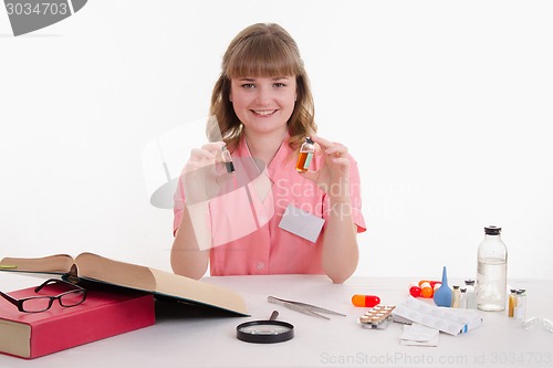 Image of Pharmacist with two ampoules