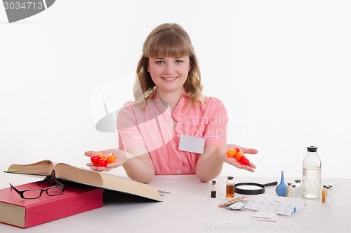 Image of Pharmacist with pills in hand