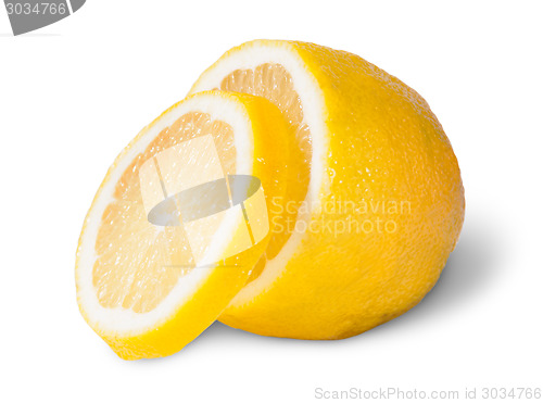 Image of Half Of A Lemon With One Slice