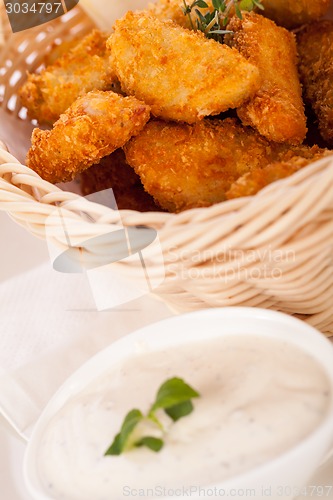 Image of Crumbed chicken nuggets in a basket