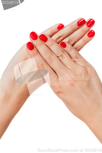 Image of Woman with beautiful manicured red fingernails