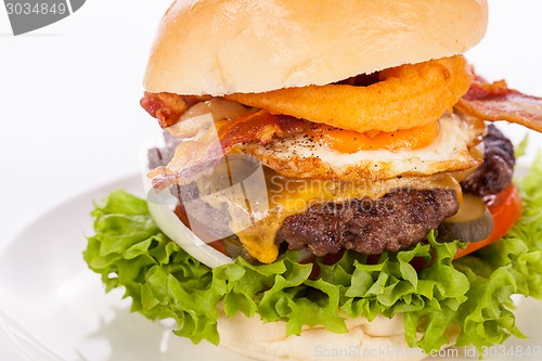 Image of Delicious egg and bacon cheeseburger