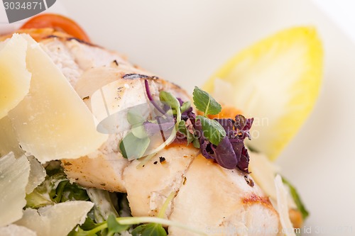 Image of tasty fresh caesar salad with grilled chicken and parmesan 