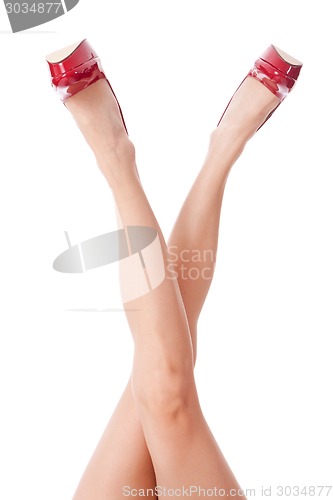 Image of Sexy bare female legs in elegant red stilettos