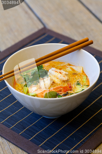 Image of Bowl of traditional Thai tom yam soup