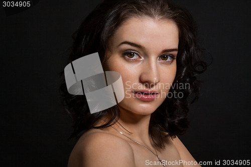 Image of Dark portrait of a beautiful woman