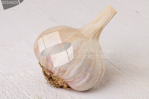 Image of Fresh garlic bulb with loose cloves