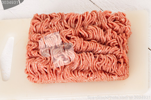 Image of Block of commercial beef mince from a store