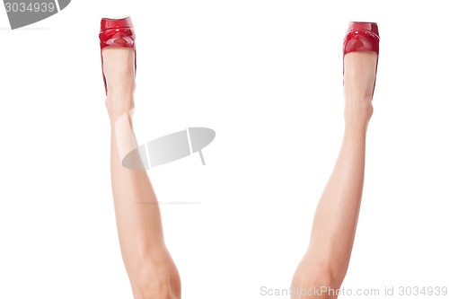 Image of Sexy bare female legs in elegant red stilettos