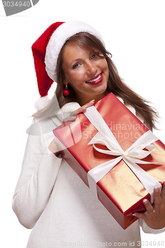 Image of Pretty woman in a Santa hat with a large gift