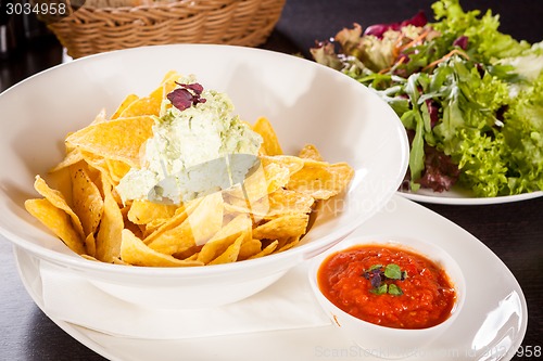 Image of Crisp corn nachos with guacamole sauce