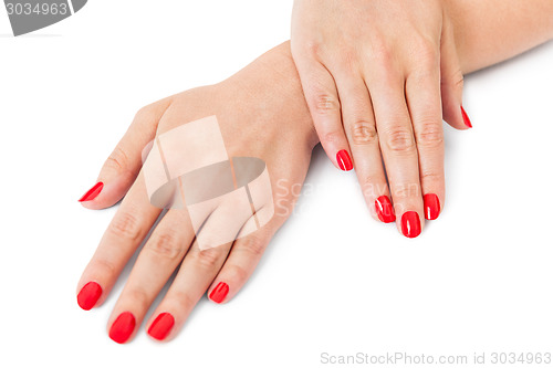 Image of Woman with beautiful manicured red fingernails