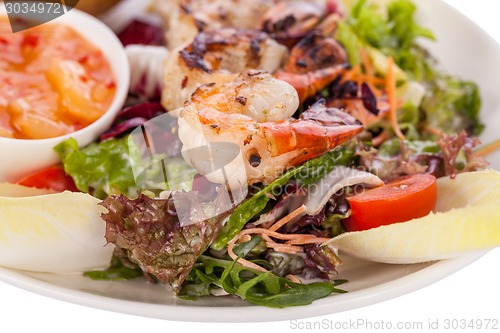 Image of Grilled prawns with endive salad and jacket potato