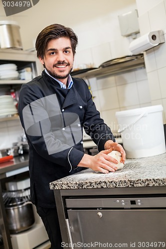 Image of Chef tossing dough while making pastries