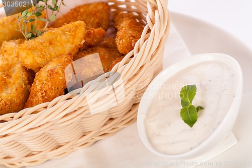Image of Crumbed chicken nuggets in a basket