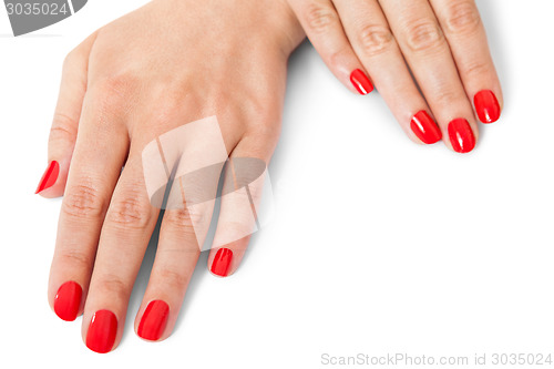 Image of Woman with beautiful manicured red fingernails