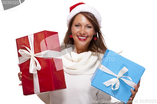 Image of Vivacious woman in a Santa hat celebrating Xmas