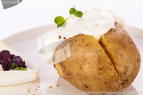 Image of Baked jacket potato with sour cream sauce