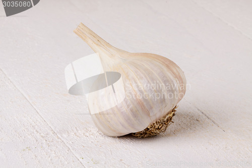 Image of Fresh garlic bulb with loose cloves