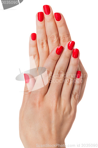 Image of Woman with beautiful manicured red fingernails