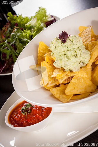 Image of Crisp corn nachos with guacamole sauce