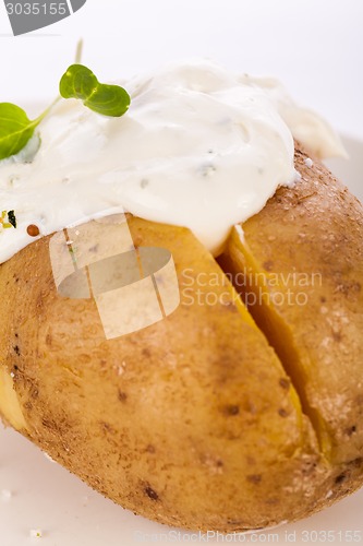 Image of Baked jacket potato with sour cream sauce