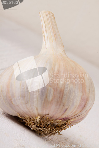 Image of Fresh garlic bulb with loose cloves