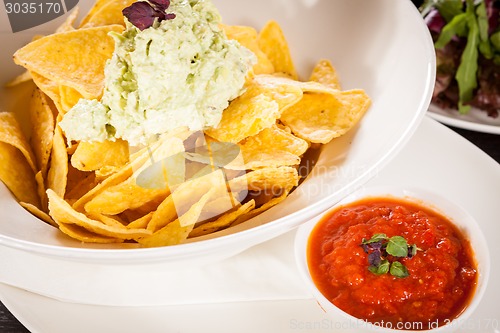 Image of Crisp corn nachos with guacamole sauce