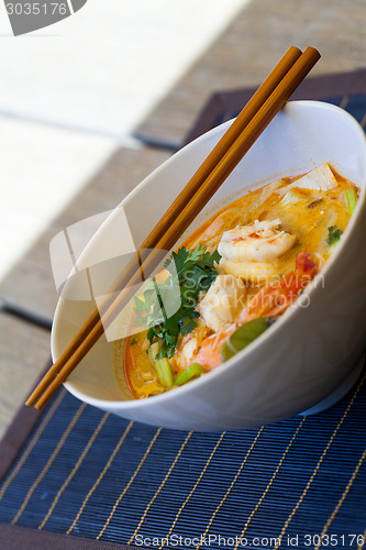 Image of Bowl of traditional Thai tom yam soup