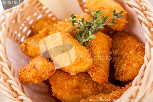 Image of Crumbed chicken nuggets in a basket