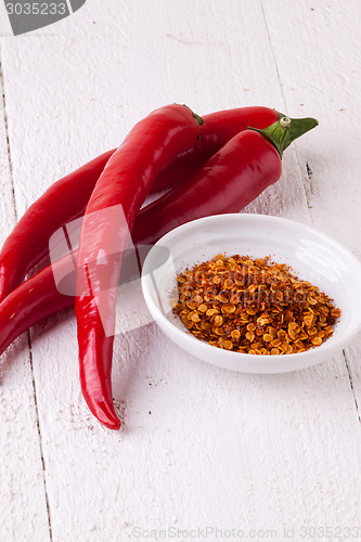 Image of Fresh red and yellow chili peppers with spice