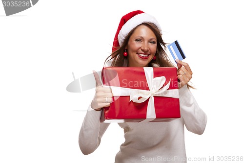 Image of Smiling woman purchasing Christmas gifts