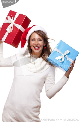 Image of Vivacious woman in a Santa hat celebrating Xmas