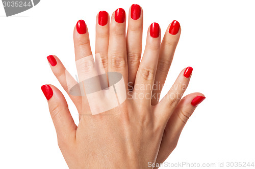 Image of Woman with beautiful manicured red fingernails